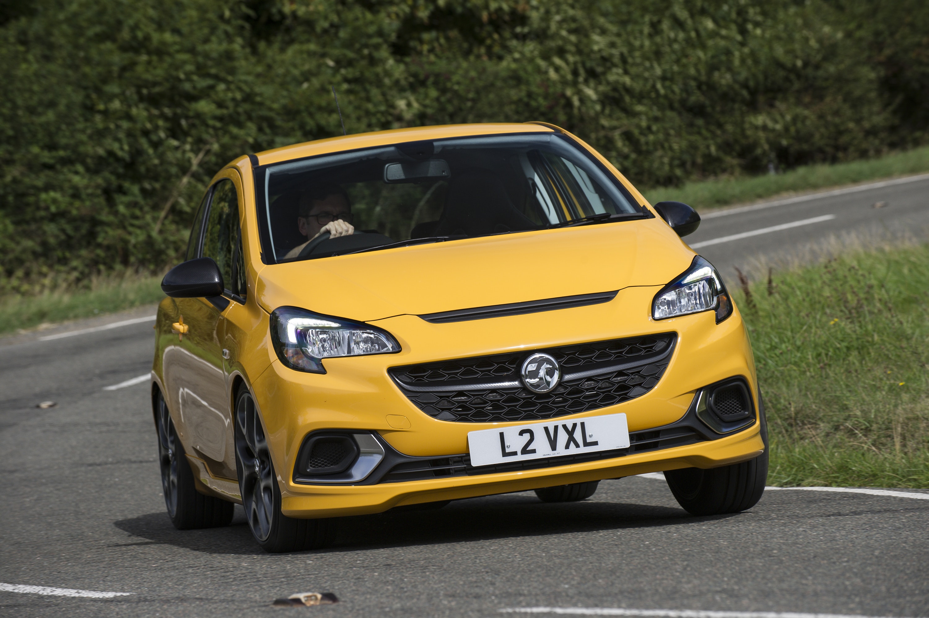 front view of Vauxhall Corsa driving on a road